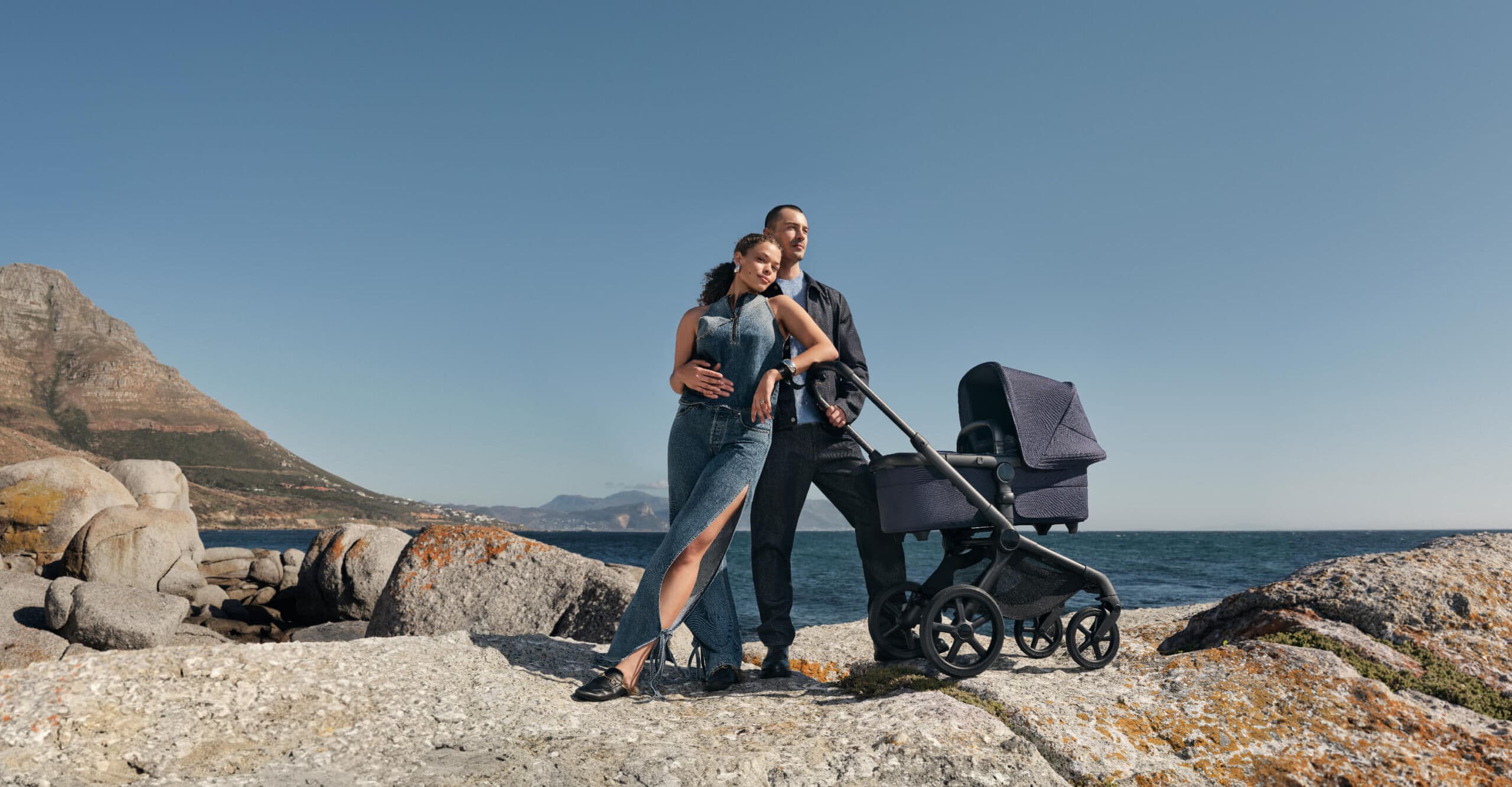 Couple with Bugaboo Fox 5 stroller on a scenic coastal trail